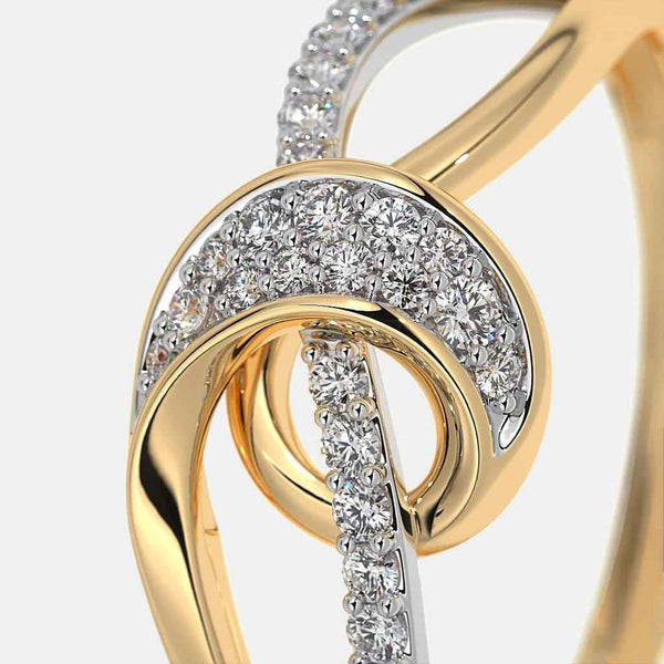 Gold ring top view with halo of pavé diamonds and a vertical row of stones