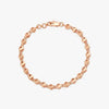 18kt rose gold charm bracelet with circular bead links and toggle clasp
