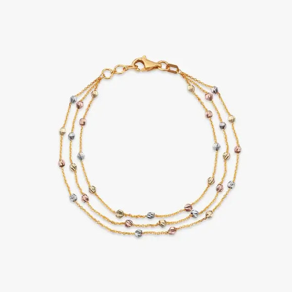 Tria Flow gold bracelet with multiple rows and small blue and white stones, lobster clasp