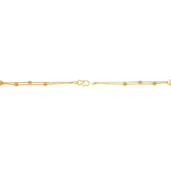 Yellow gold carved bead bracelet with small links and lobster clasp