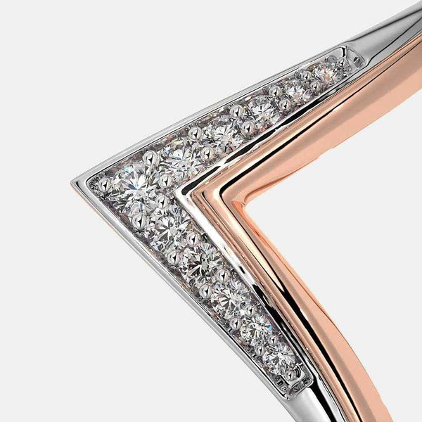 Chevron diamond ring side view with pavé diamonds across the V-shaped band in rose and silver.