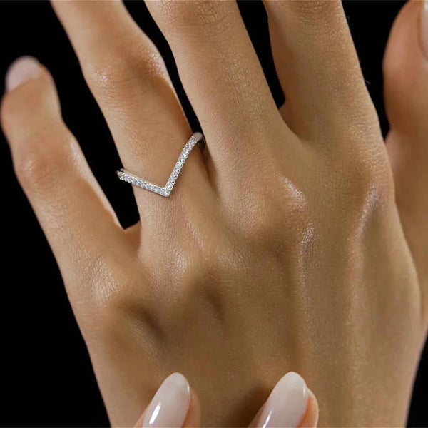 Chevron diamond ring with V-shaped top and pave stones on a silver-toned band