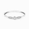 Silver bracelet with curved pavé bands and central round charm