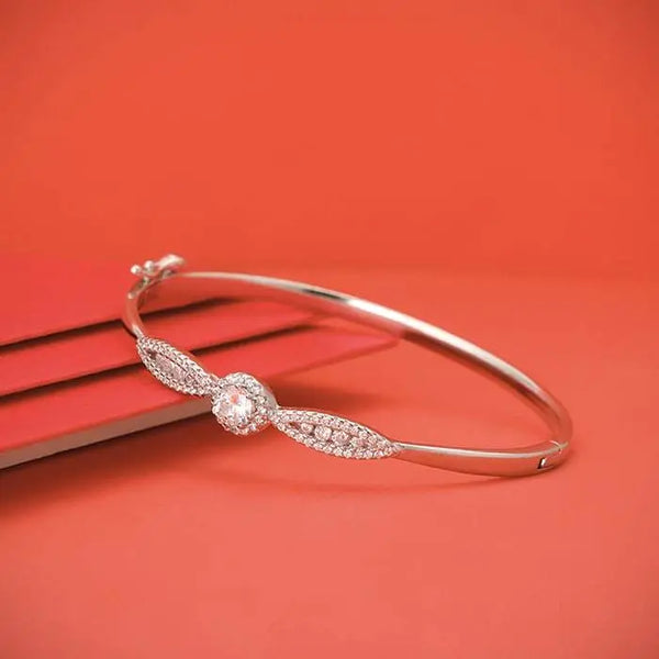 Silver sparkly bangle bracelet with round charm and pavé detail