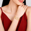 Gold bracelet with open circular links on wrist