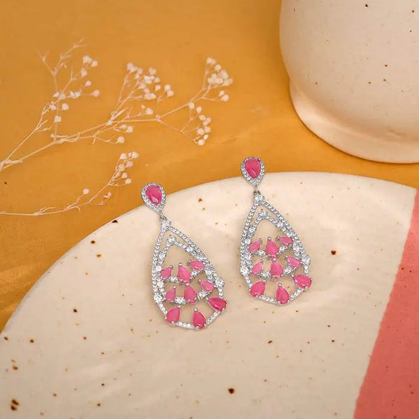 Silver drop earrings with pink heart-shaped stone clusters and crystal border, dangling