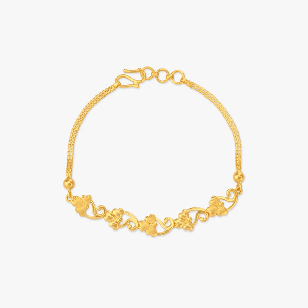 Gold vine charm bracelet with link chain, round clasp, and textured beads