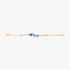 Slim blue butterfly bracelet with gold-tone chain and small blue charm links.