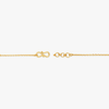 Gold-tone bracelet clasp with heart-like toggle and chain links.