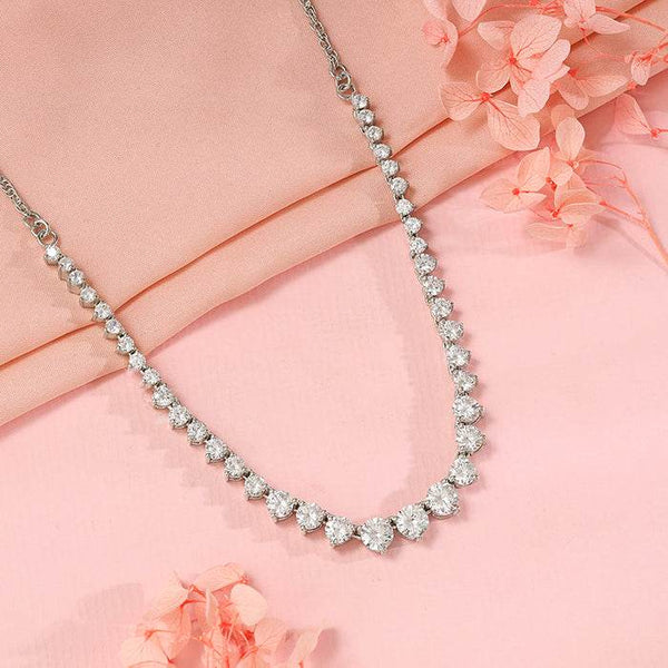 Silver-tone gemstone tennis necklace with teardrop pavé stones, close-up