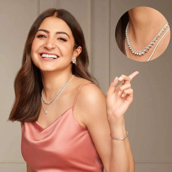 Silver-tone gemstone necklace with small pavé stones, worn at collarbone