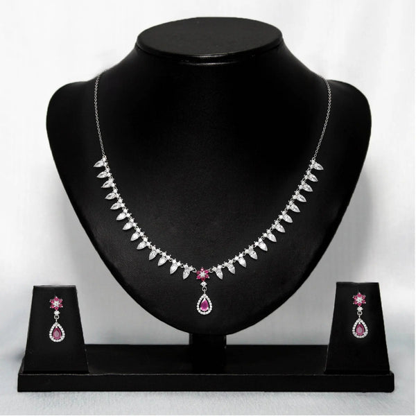 Silver-tone necklace with pink flower center charm and matching earrings set