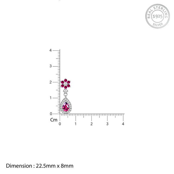 Pink flower teardrop charm size 22.5mm x 8mm on measurement scale
