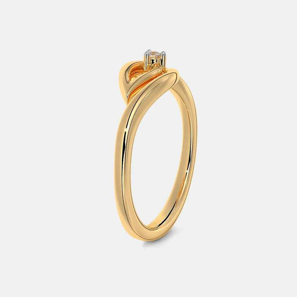 Gold ring with raised crown prongs holding a small diamond
